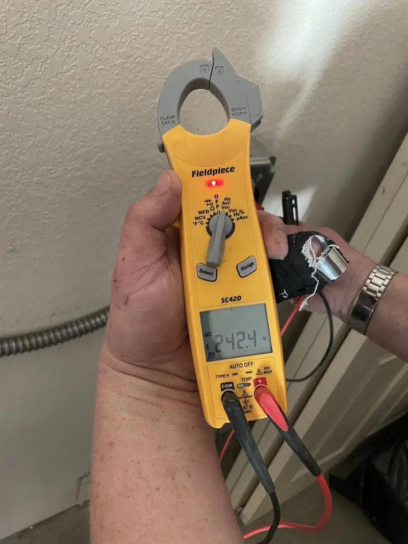 Voltage testing with clamp meter during Whole House Surge Protector in Leesville